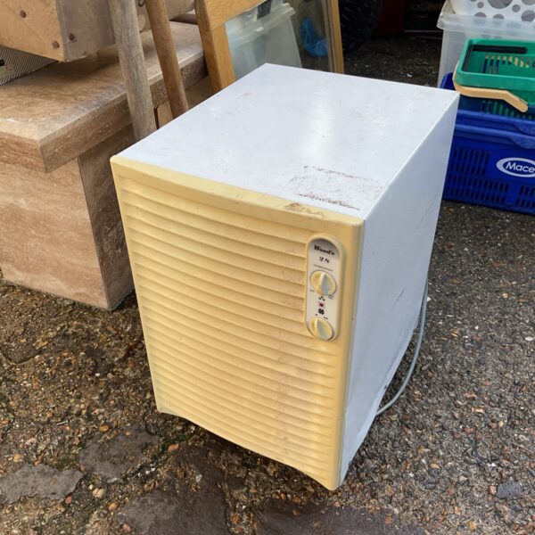 Cream Wood's 28 dehumidifier with ribbed front and control dials