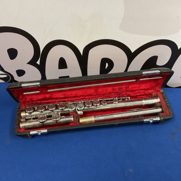 Vintage W.T. Armstrong flute in open case with red lining