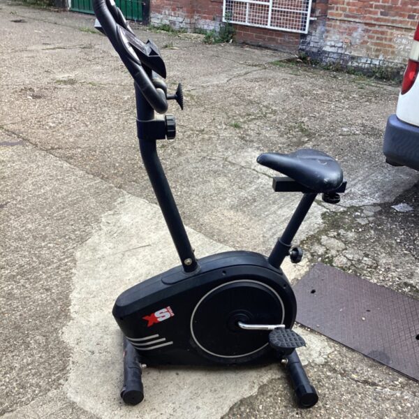 Black XS Sports fitness bike for home cardio exercise.