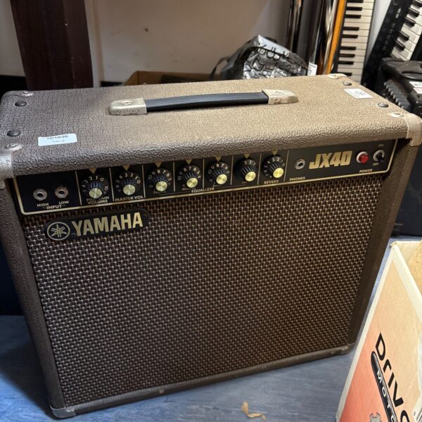 Vintage Yamaha JX40 guitar amplifier with control panel visible.
